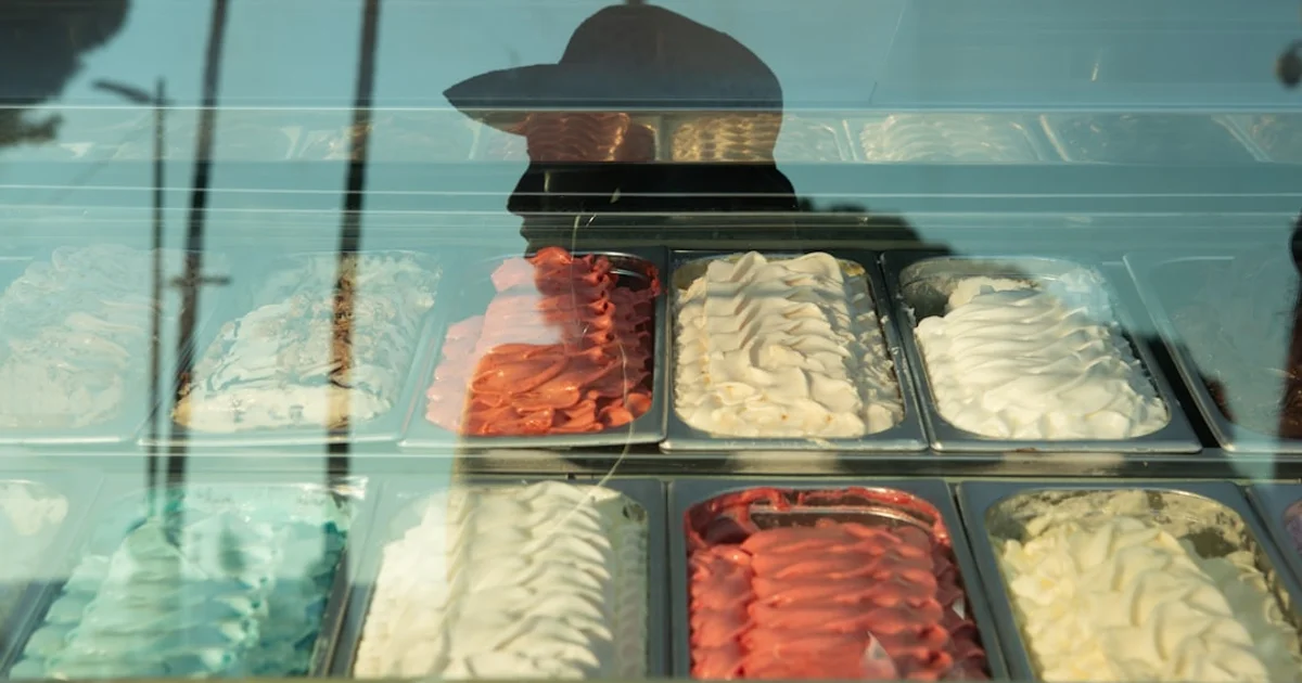 Ice cream display in a UAE supermarket with Arabic halal certification labels visible