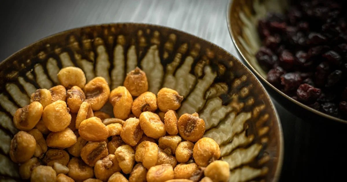 Snack crackers and crisps in bowls on a table