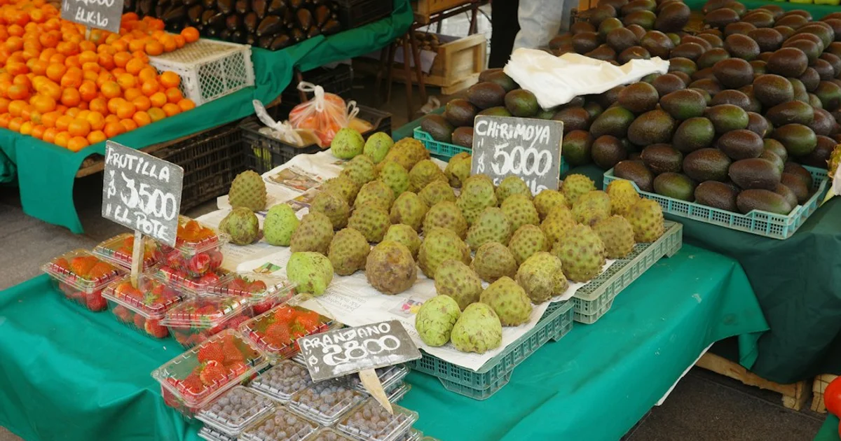 Fresh fruit, nuts and mineral salt on a market table — the product categories exempt from Indonesia's mandatory halal certification under Decree 301 of 2026