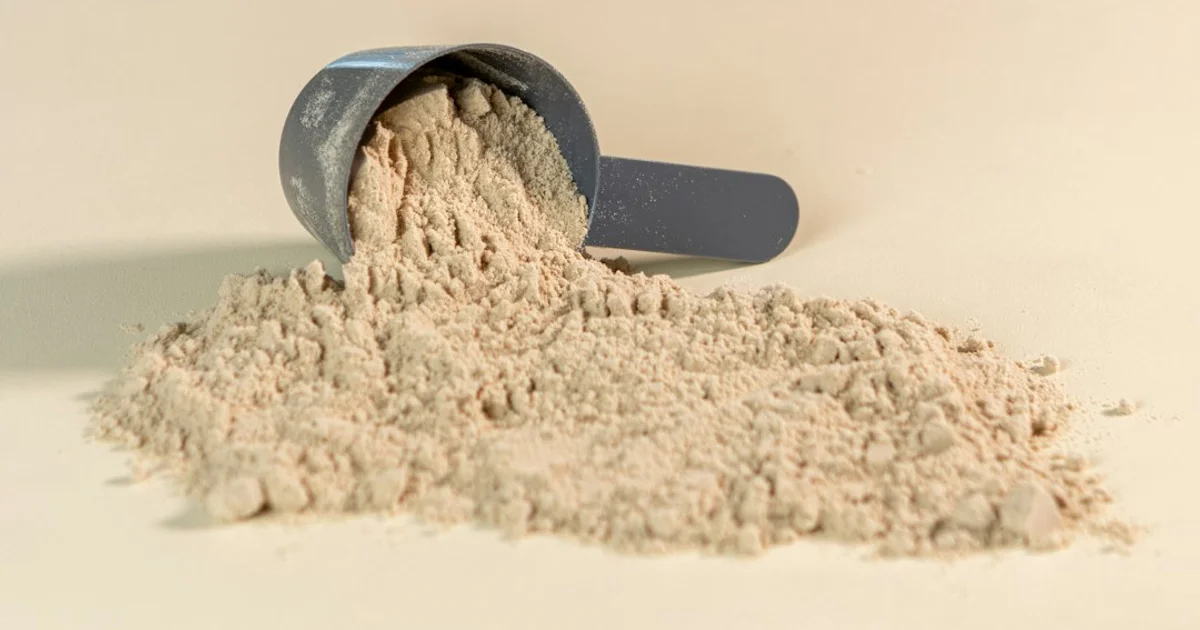 Tubs of protein powder and supplement capsules on a gym shelf — which ESN products are halal certified