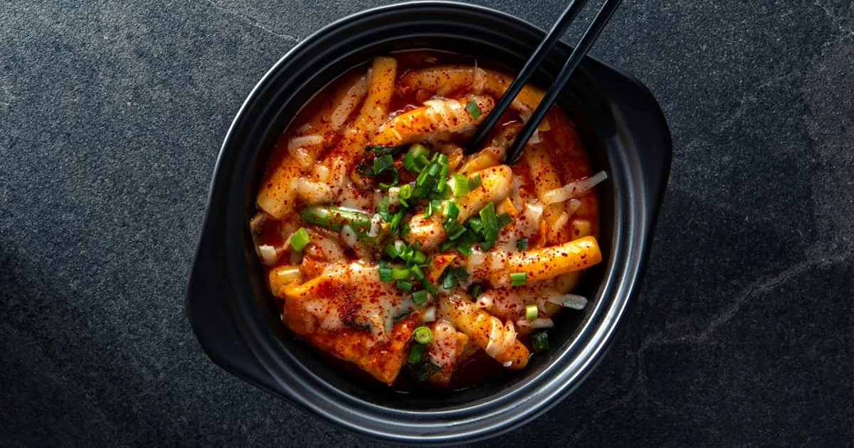 Spicy Korean rice cakes in red sauce, representing tteokbokki (topokki)