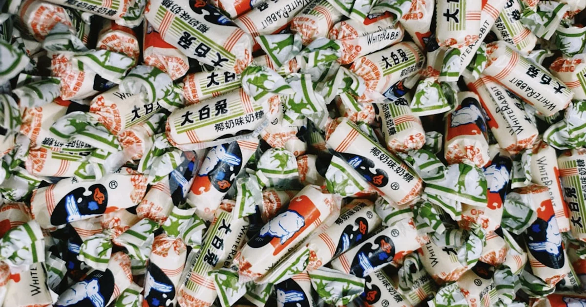 White Rabbit candy wrappers in the iconic blue and white design with the rabbit logo