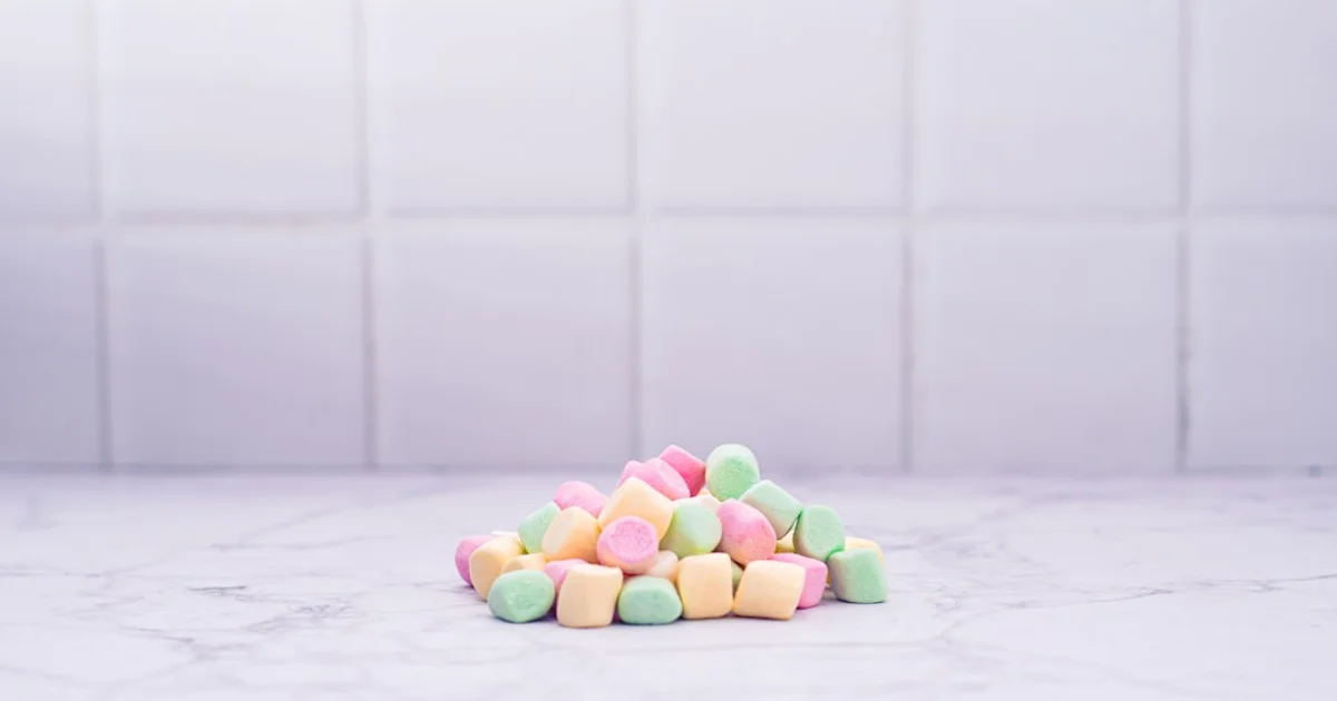 Colourful gummy candy and marshmallows on a shelf — checking Malaysia's halal gelatin sourcing