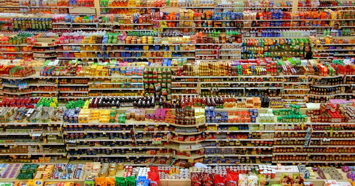 Supermarket shelf of Malaysian and Indonesian packaged foods side by side — the joint Malaysia-Indonesia halal council and mutual recognition of certificates
