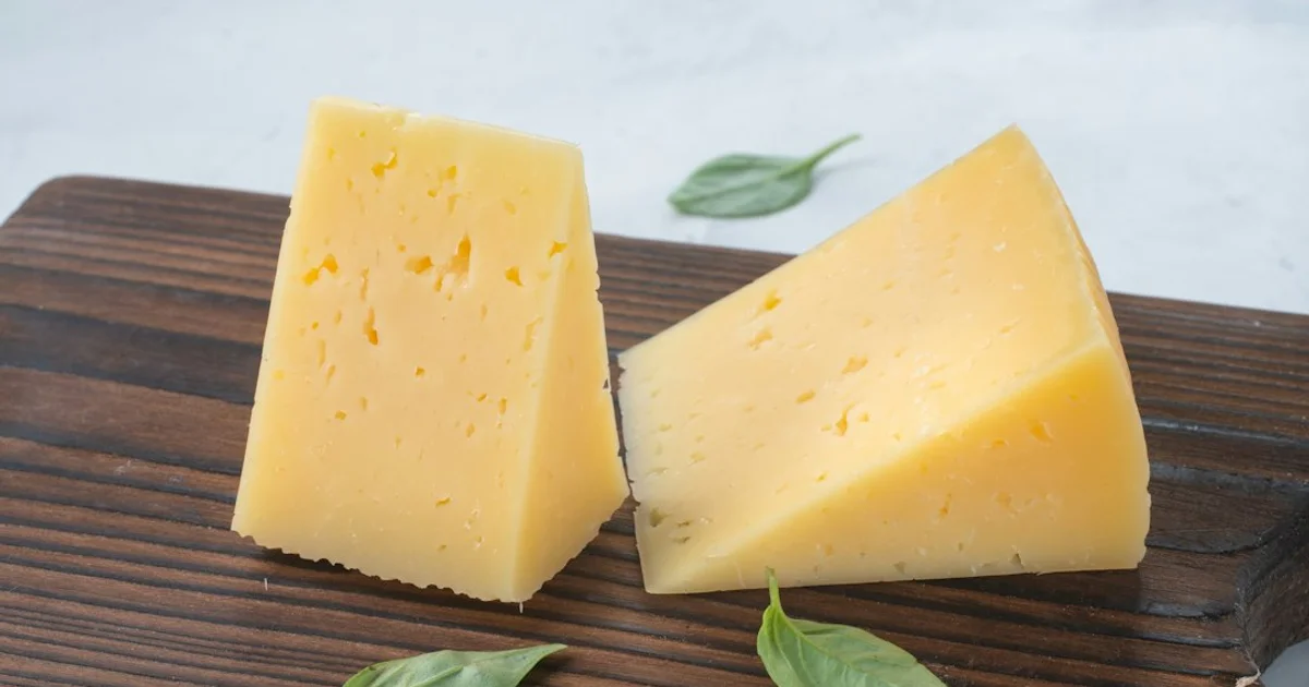 Blocks of cheddar cheese on a supermarket shelf — what the Certified Halal label on Tillamook cheese means