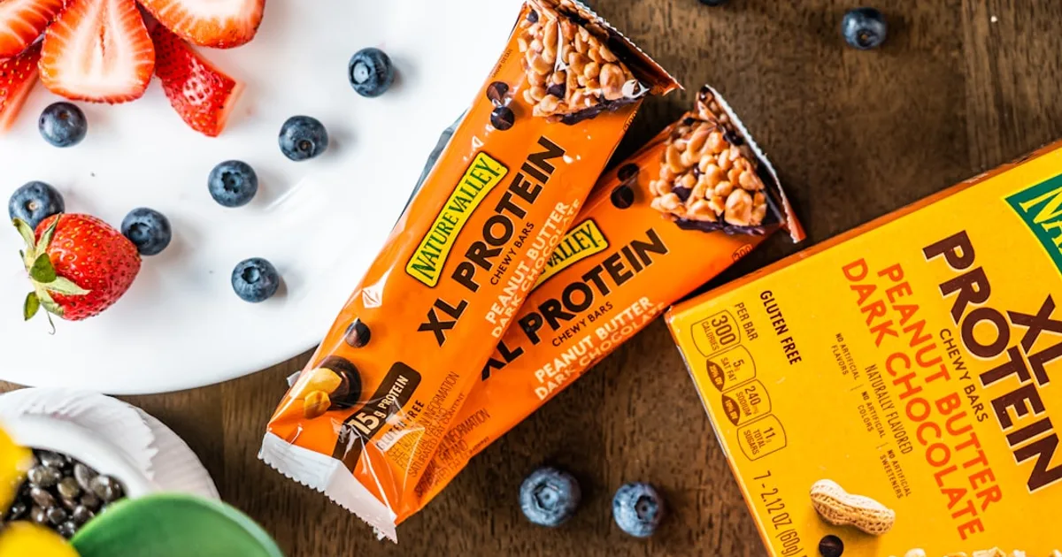 UK protein bars lined up — halal audit of 50 bars including Grenade, Trek, Quest, Barebells